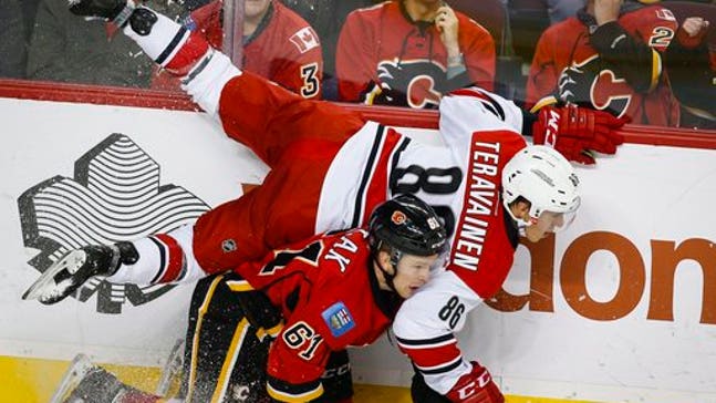 Rask scores again, Hurricanes beat Flames for 1st win